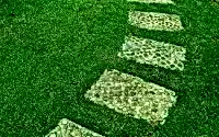 thumbs_12027986-the-stone-block-walk-path-in-the-park-with-green-grass-background